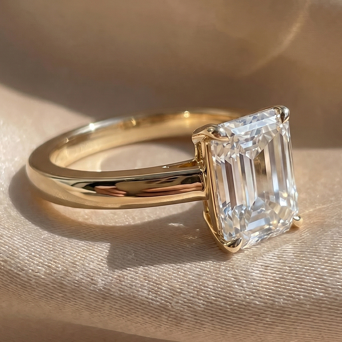 Emerald solitaire engagement ring